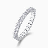 Moissanite pavé eternity band, angled view showing multiple round stone settings
