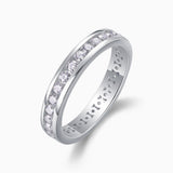 Moissanite eternity band with polished interior and pave row of round stones