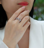White gold vermeil half-row moissanite wedding band on finger with bright pavé accents
