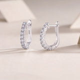White gold vermeil huggie hoop earrings with pavé moissanite stones, side view
