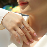 Cross band moissanite ring worn on hand, small rectangular cross with sparkle