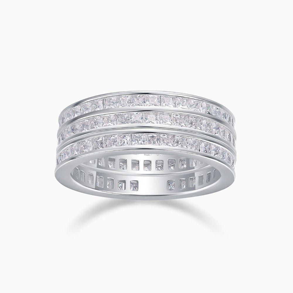 Triple row moissanite wide band ring with white stones on a white metal band