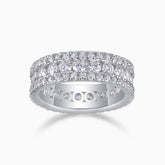 Triple-row pavé moissanite wedding band with three rows of bright round stones, white metal