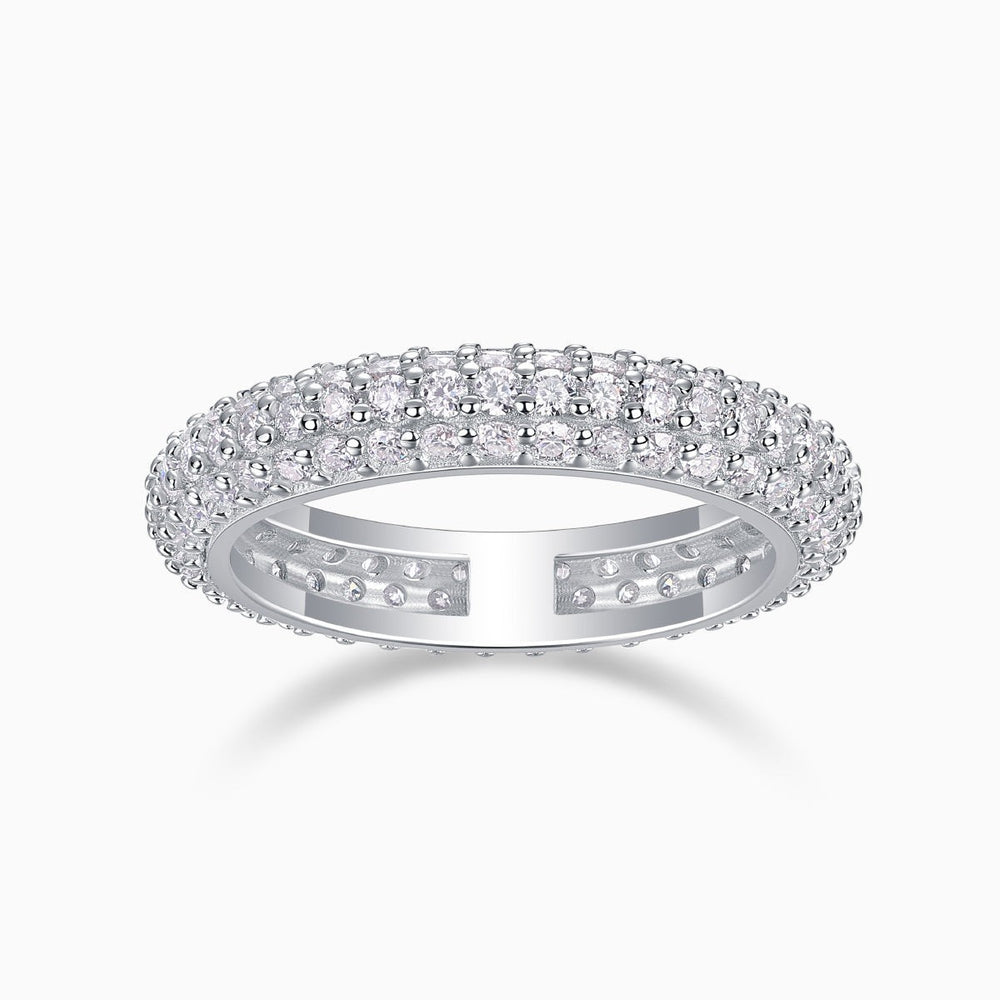 Triple-row pavé moissanite band ring, white gold vermeil, prong-set sparkle profile.