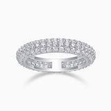 Triple-row pavé moissanite band ring, white gold vermeil, prong-set sparkle profile.