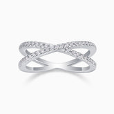 X-Cross Moissanite pavé band ring with X-shaped crossover and clear stones on white metal