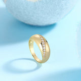 Yellow gold vermeil dome band with a row of white moissanite stones