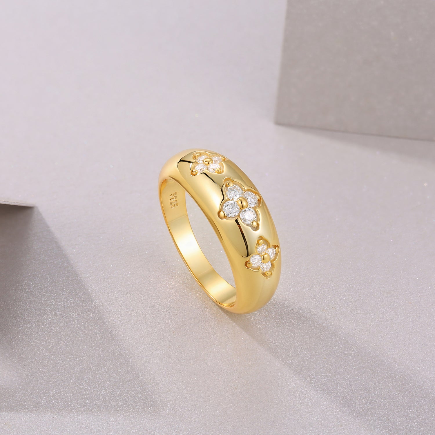 Yellow gold vermeil eternity band ring profile with round stone clover motifs