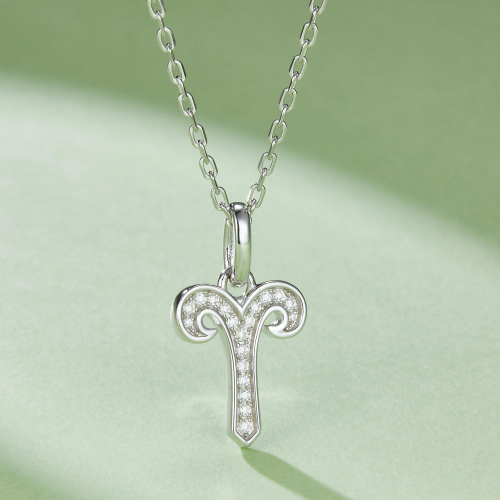 Aries zodiac pendant necklace with ram-horns design and moissanite sparkle