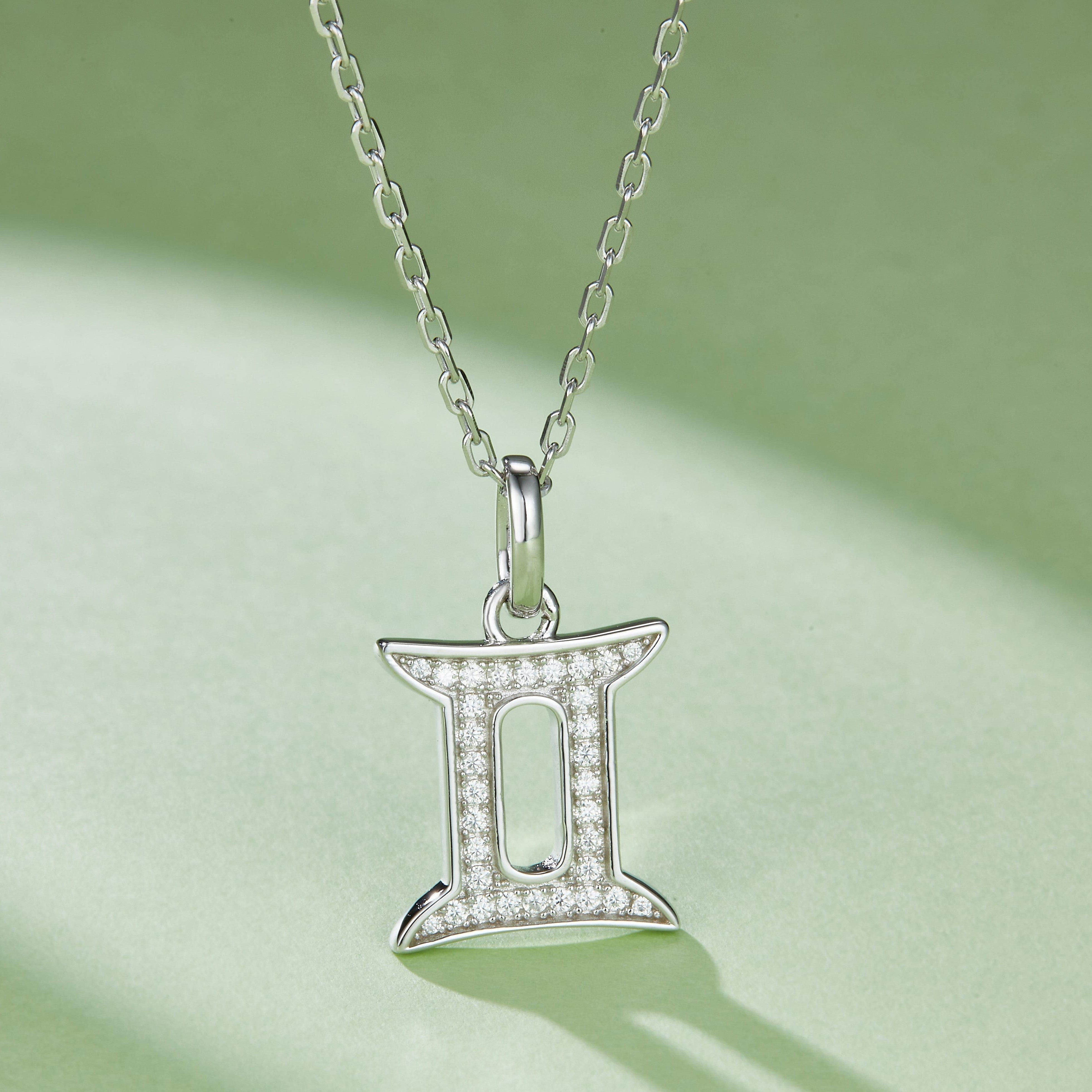 Gemini zodiac pendant in white gold vermeil, pavé stones framing the double-bars