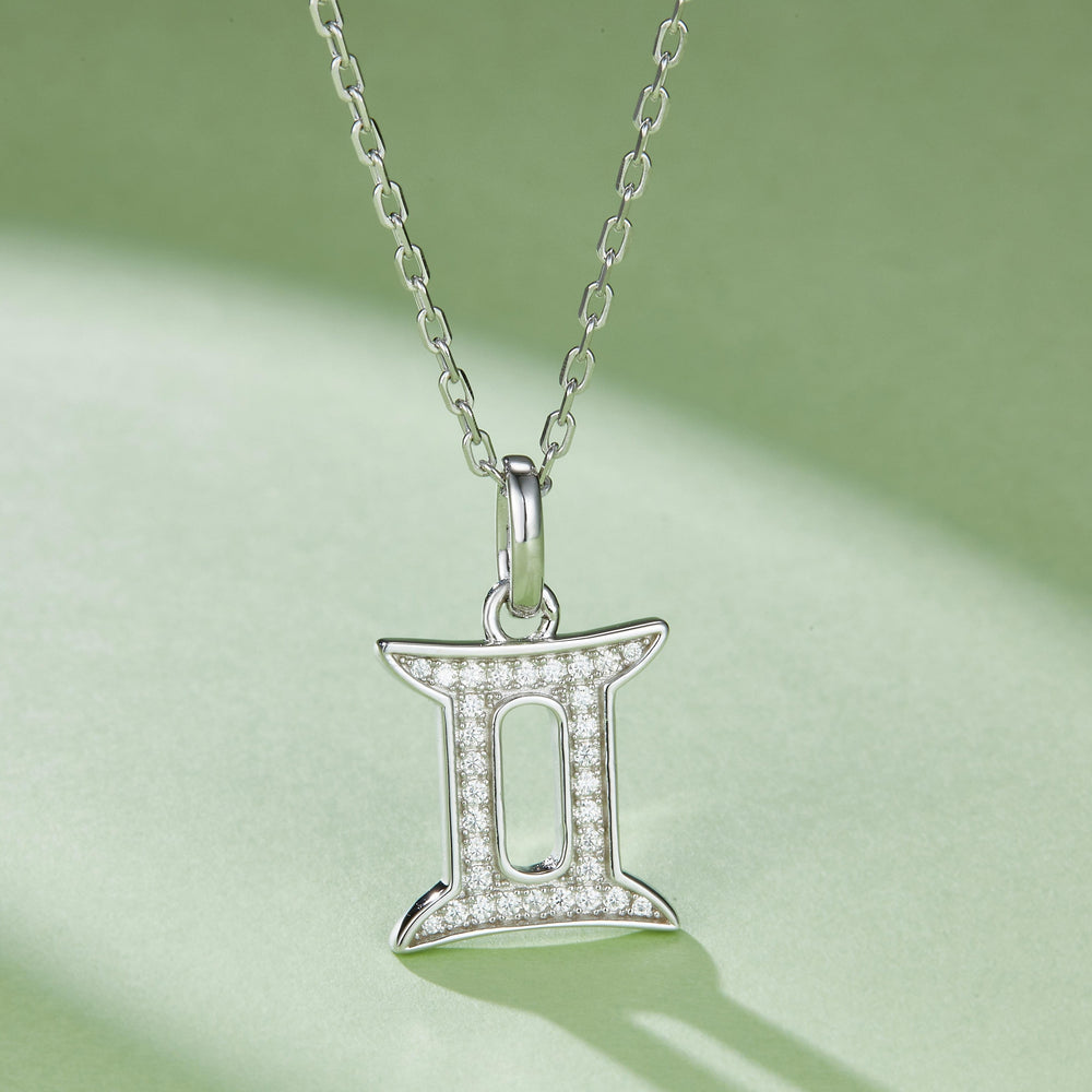 Gemini zodiac pendant in white gold vermeil, pavé stones framing the double-bars