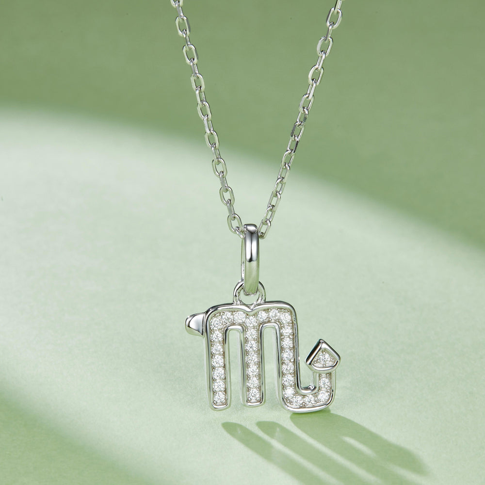 Scorpio glyph pendant with pavé-look stones on hanging bail and link chain