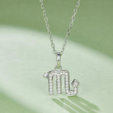 Scorpio glyph pendant with pavé-look stones on hanging bail and link chain
