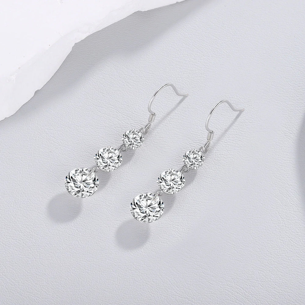 Cascade drop earrings with three round moissanite stones, white gold vermeil hooks