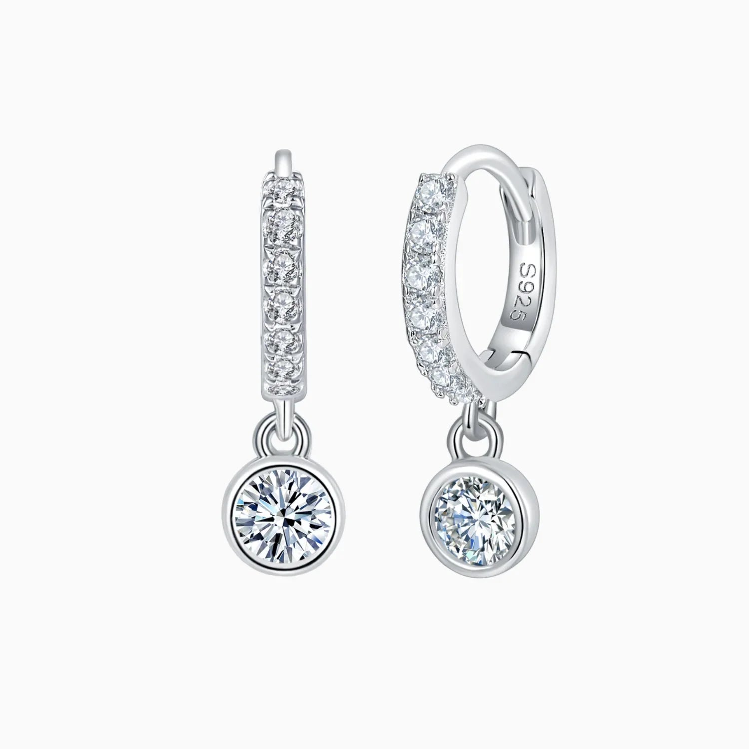 Side view of pavé huggie bezel earrings with round moissanite dangling