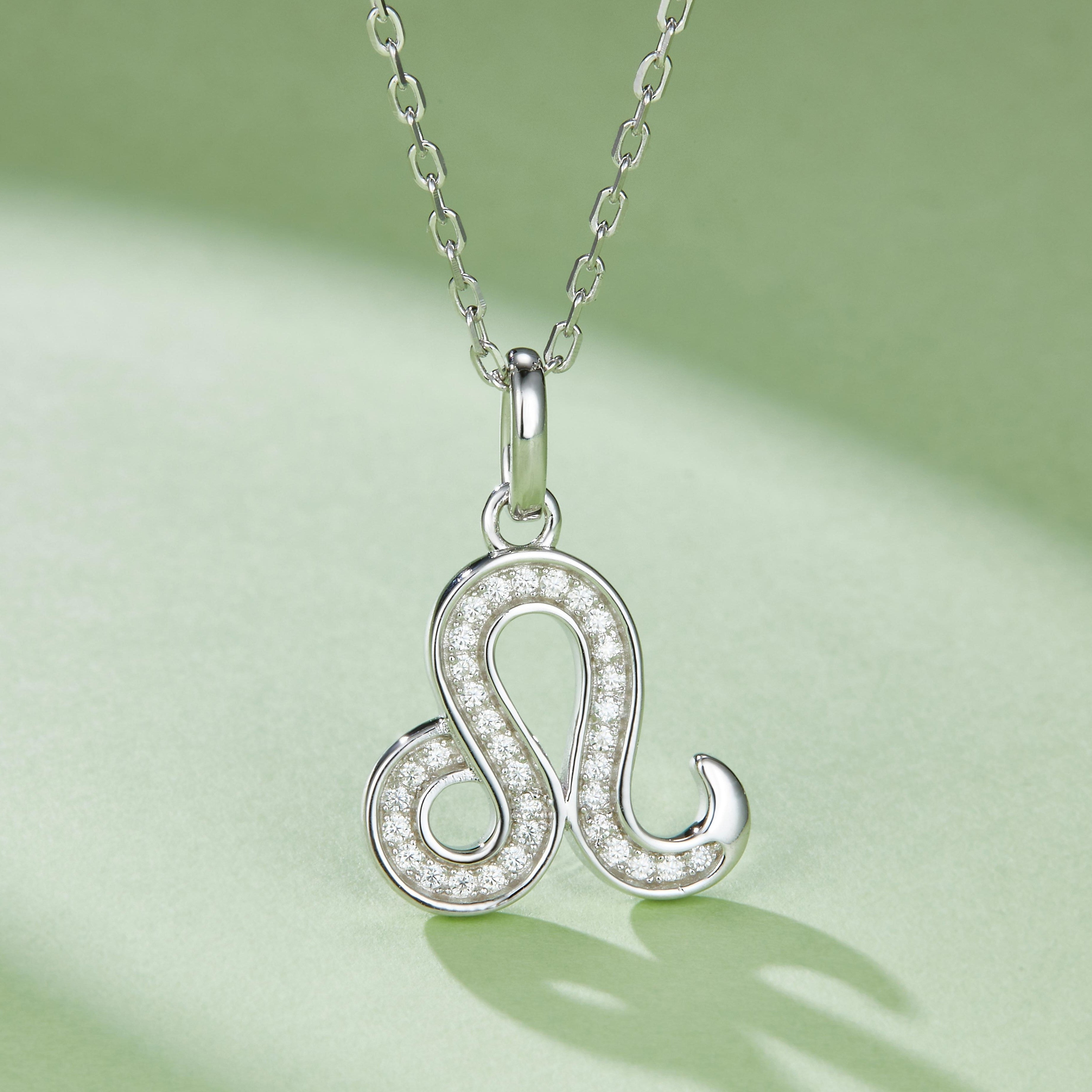 Side view: Leo zodiac pendant with moissanite halo, white gold vermeil chain