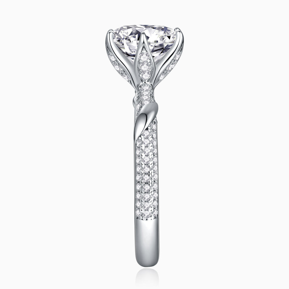 Vertical view of pavé moissanite ring with round center stone and full-shank pave detailing