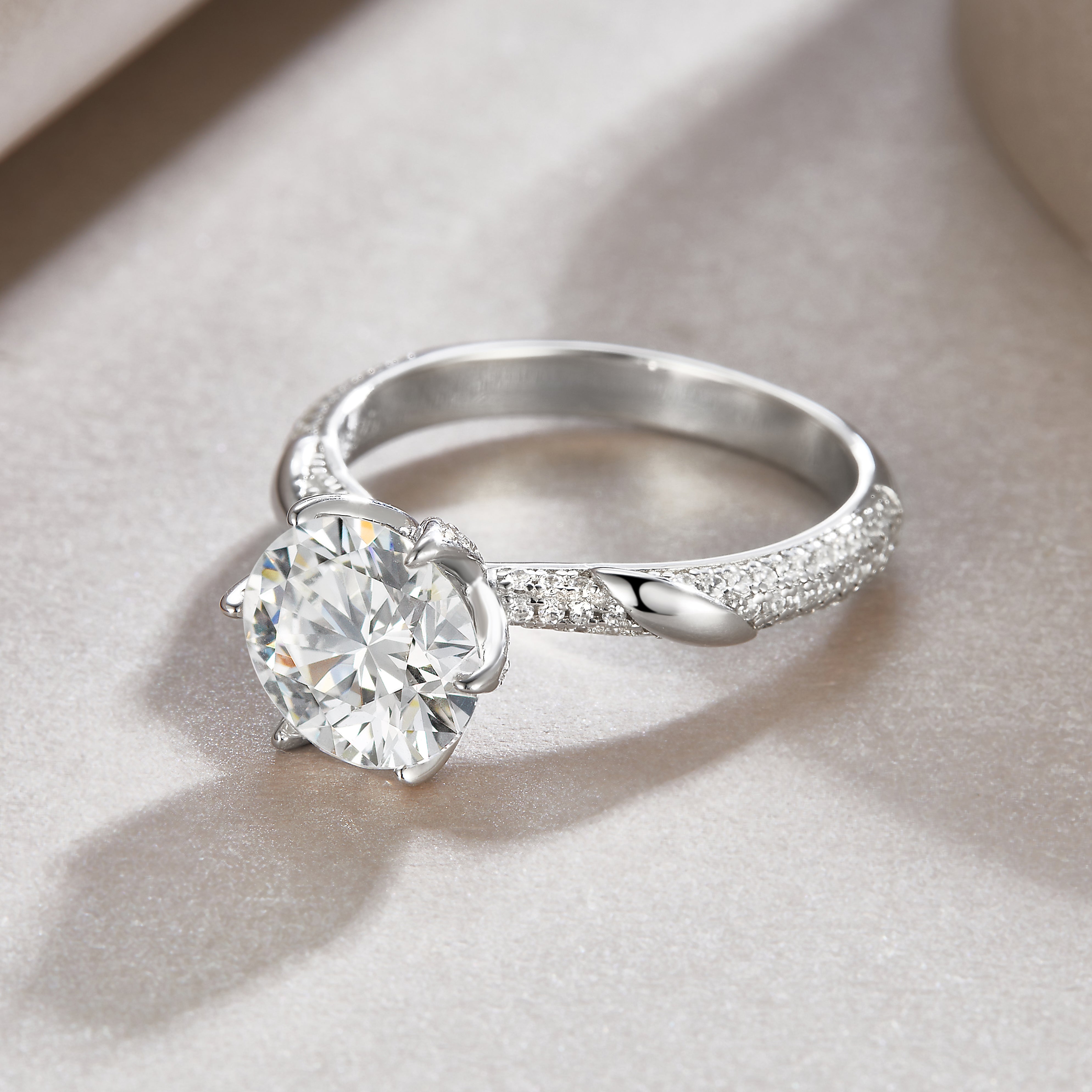 3ct moissanite ring with round center stone and twisted pavé band, white gold vermeil
