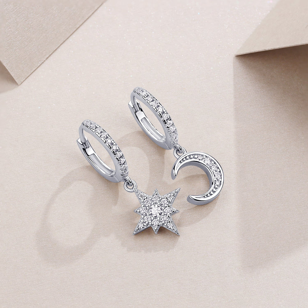 Asymmetric moon & star drop earrings with pavé halos, white gold vermeil finish