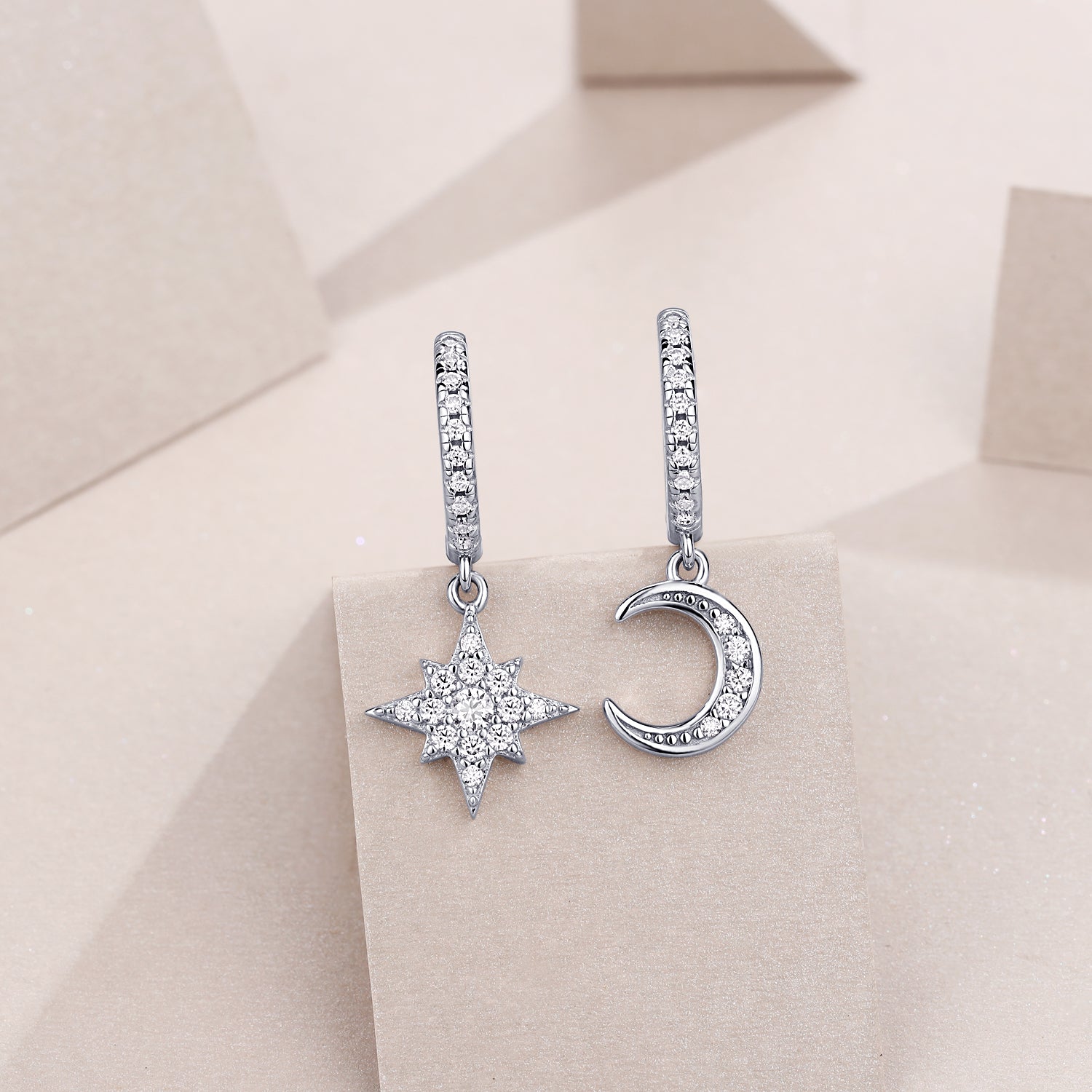 Moon and star drop earrings with pavé highlights on white gold vermeil