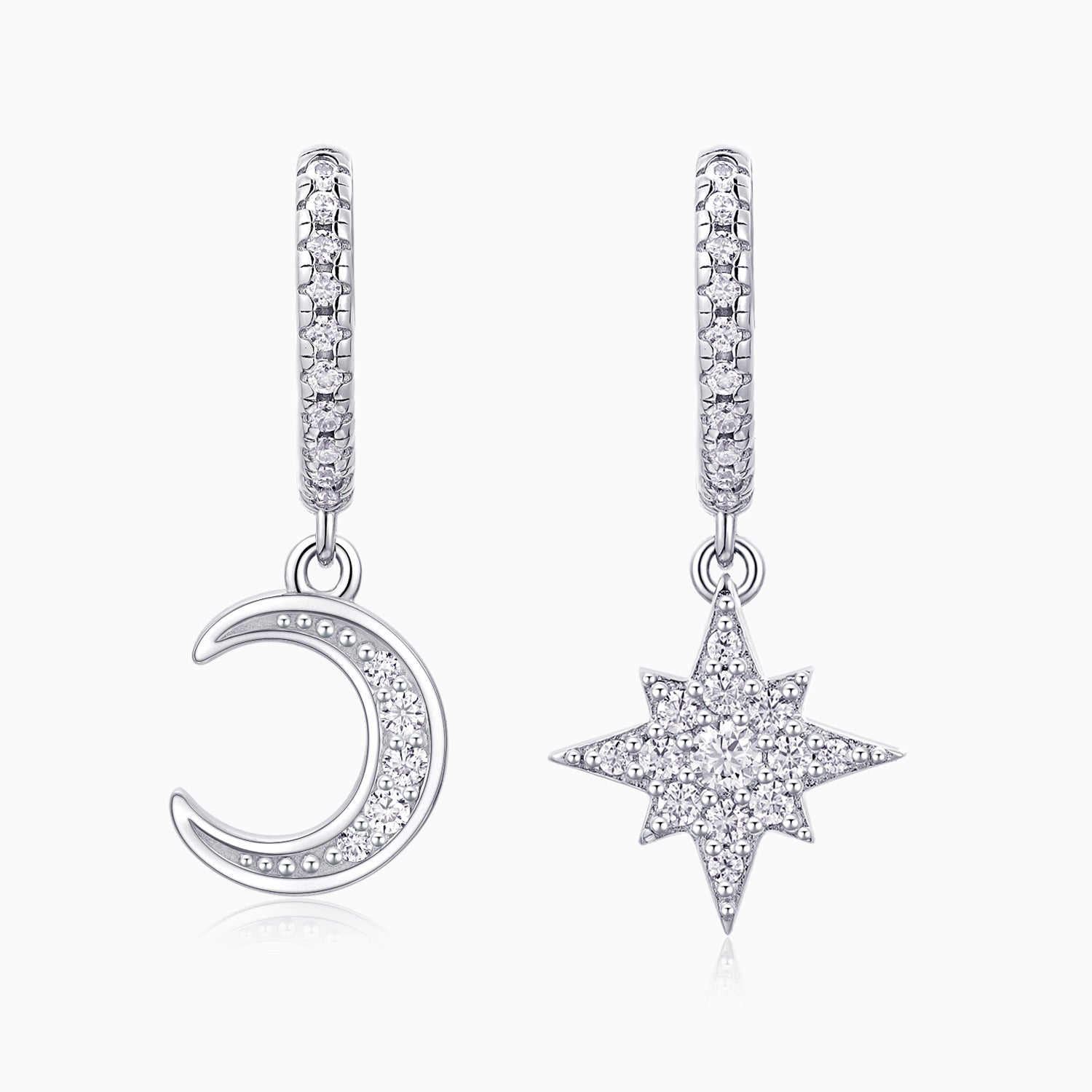 Asymmetric moon and star drop earrings in white gold vermeil with pavé detailing