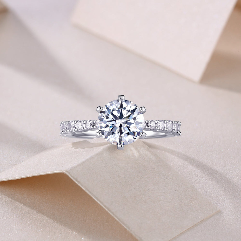 Classic round moissanite pave wedding ring, pavé band and large round center stone