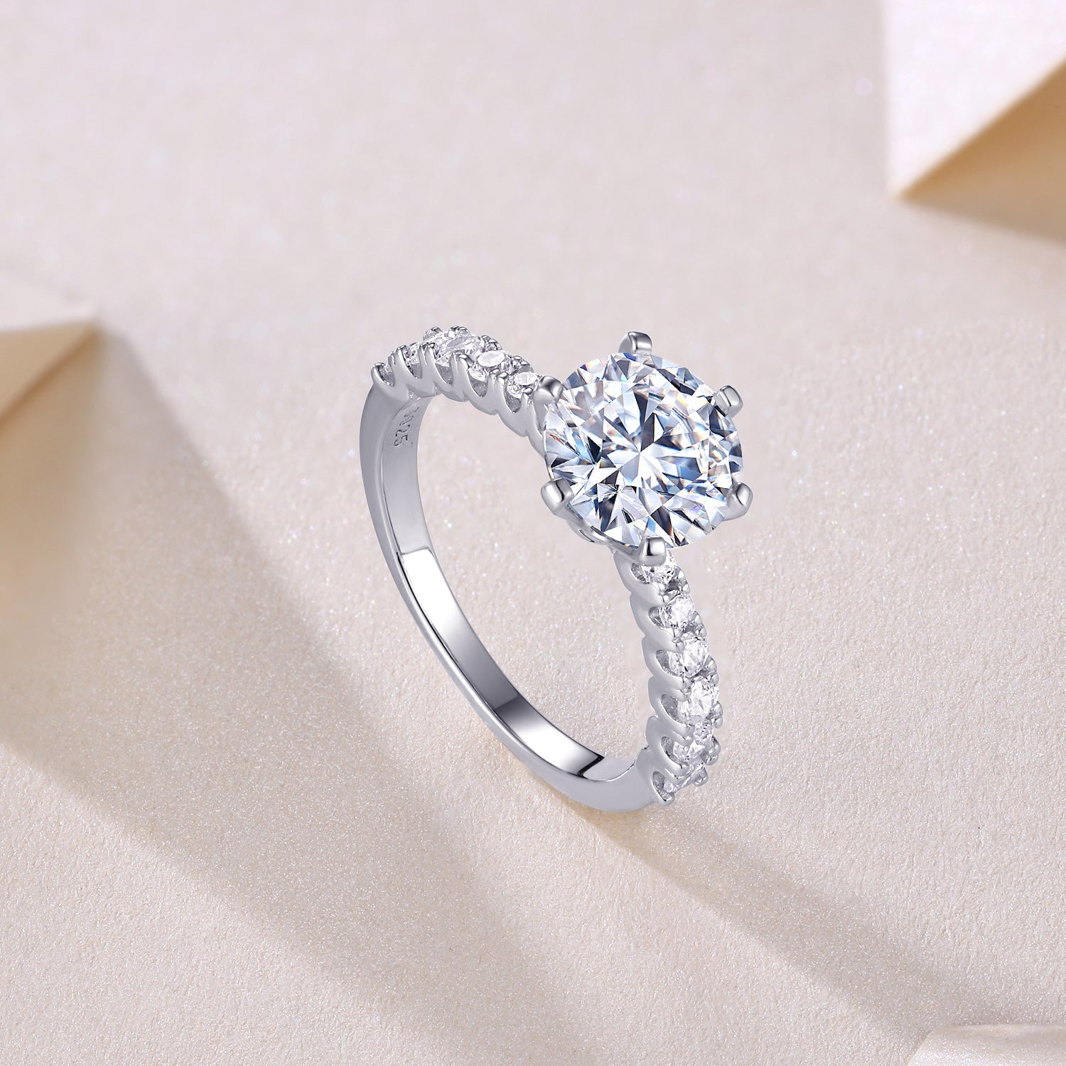 Side angle of round moissanite pave wedding ring, pavé stones along the shank