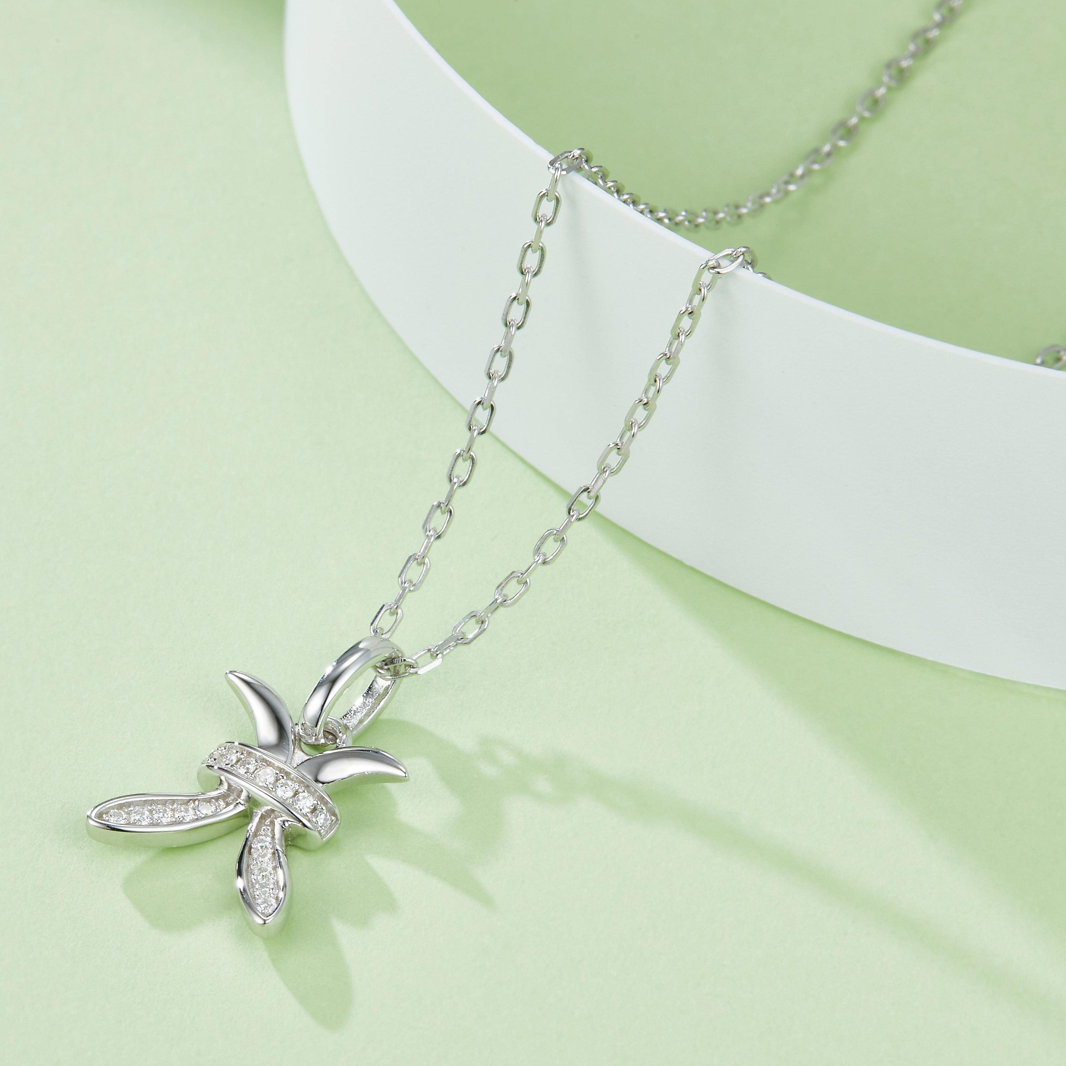 Pisces moissanite pendant close-up on chain, white gold vermeil, starfish-like pavé motif