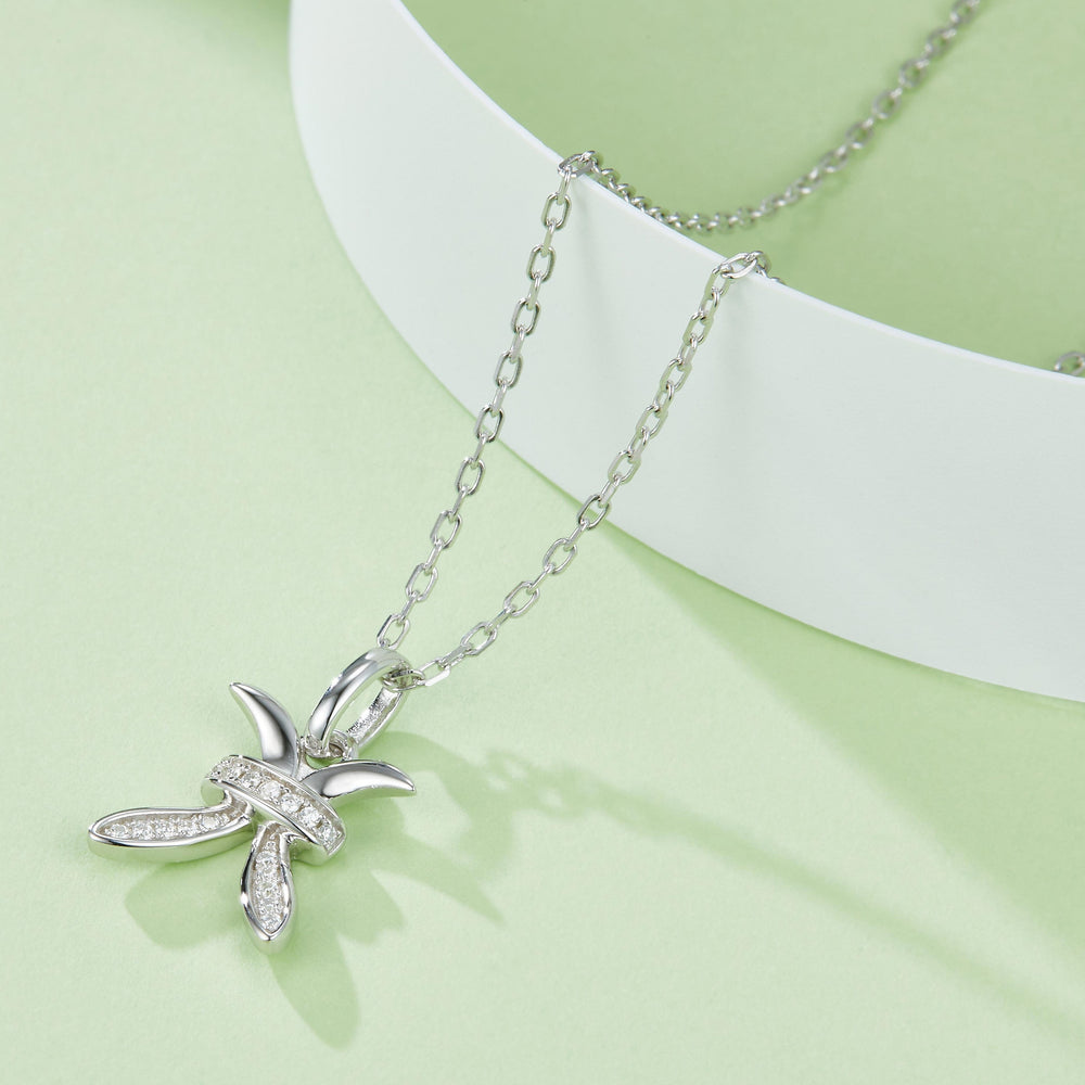 Pisces moissanite pendant close-up on chain, white gold vermeil, starfish-like pavé motif