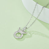 Taurus zodiac pendant necklace, oval center ring with pavé crystal halo and links