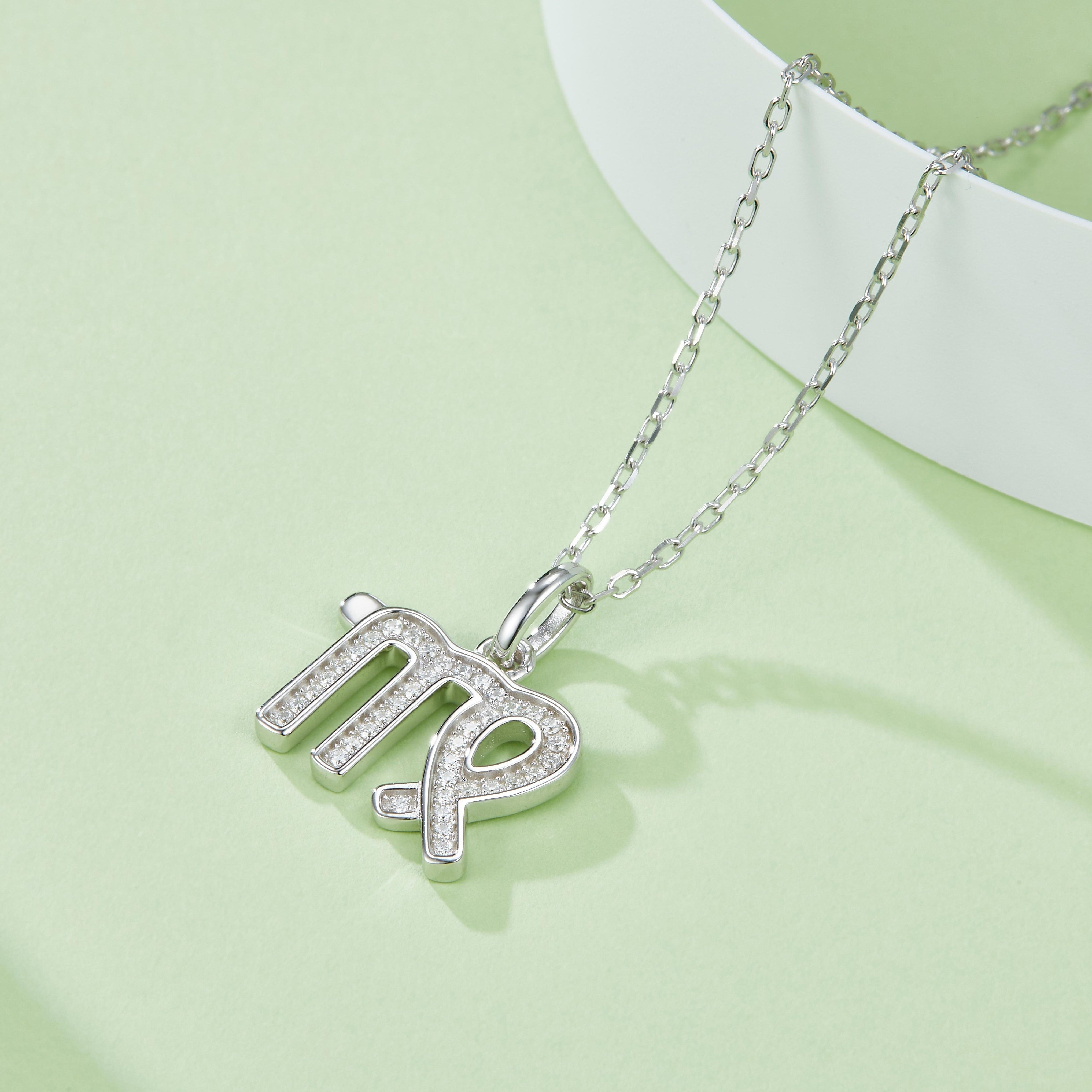 Virgo pendant necklace with chain; pavé “Virgo” letters and green enamel accents