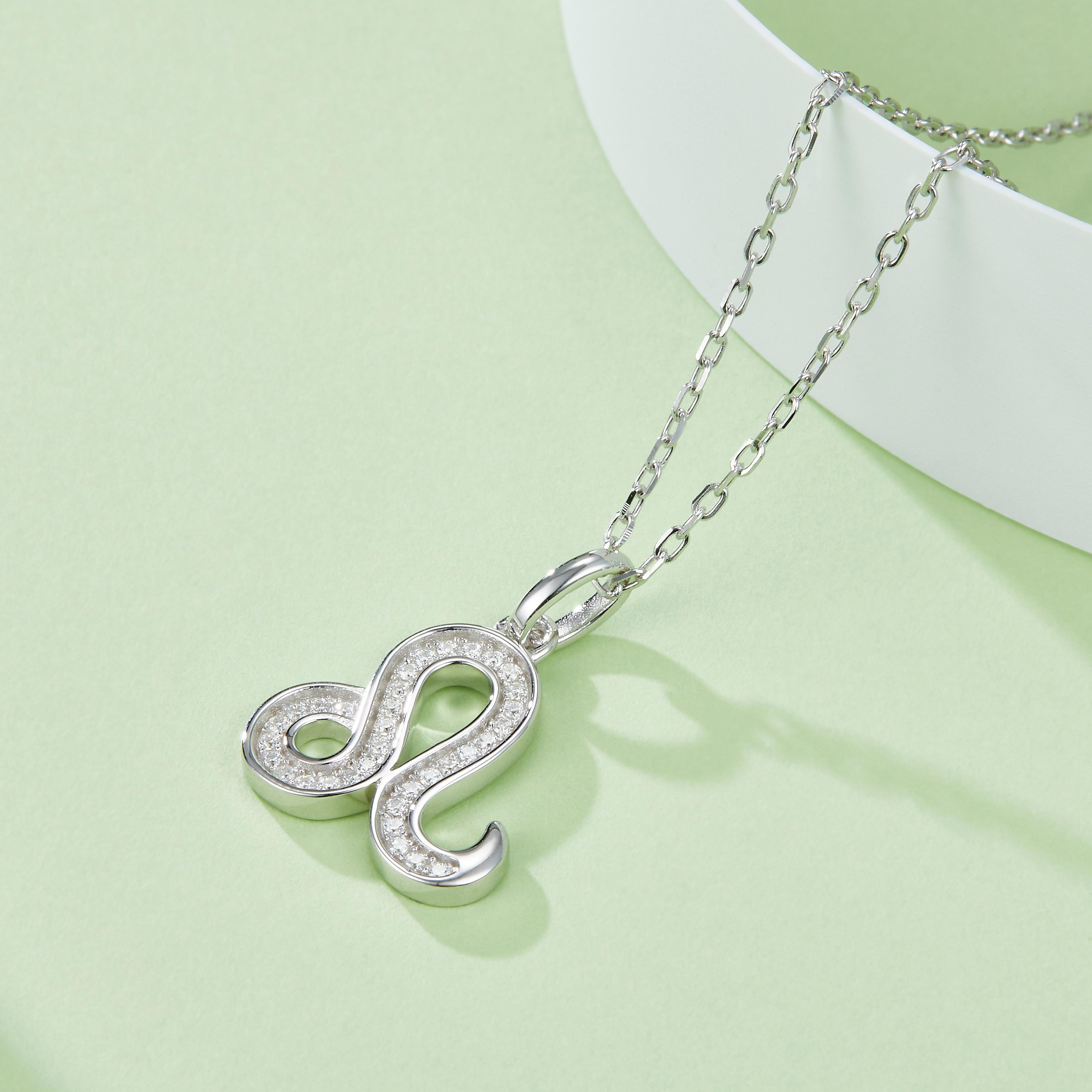 Leo zodiac pendant with moissanite stones, bail and link chain detail, white gold