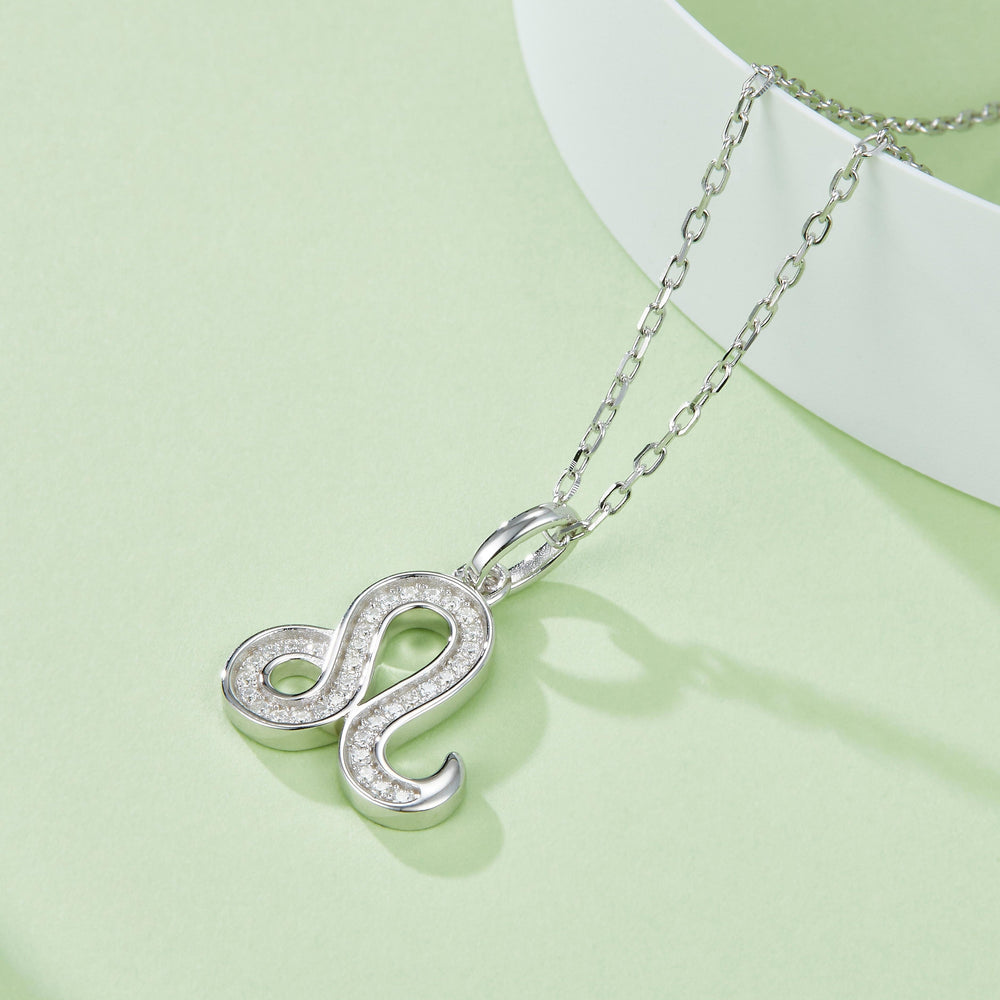 Leo zodiac pendant with moissanite stones, bail and link chain detail, white gold