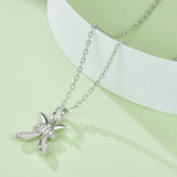 Pisces moissanite pendant close-up on chain, white gold vermeil, starfish-like pavé motif
