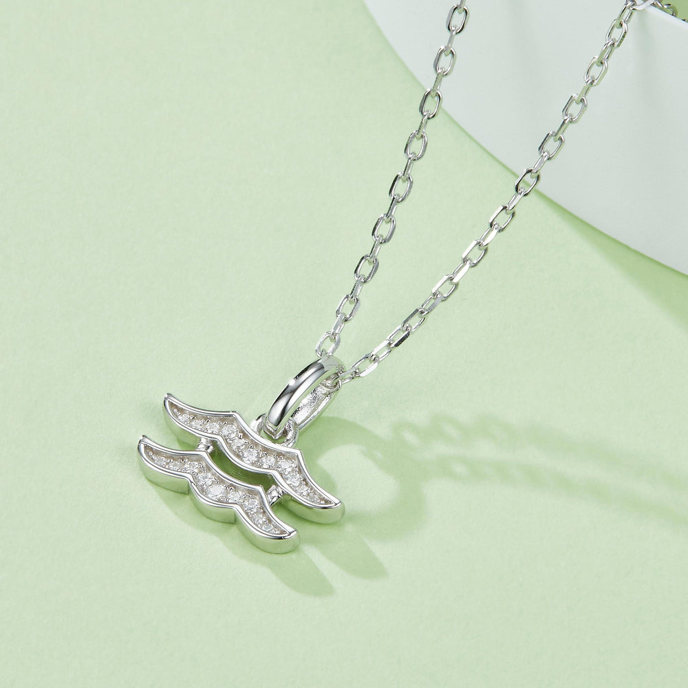 Aquarius pendant necklace, side view of wave glyph with sparkling stones on silver links