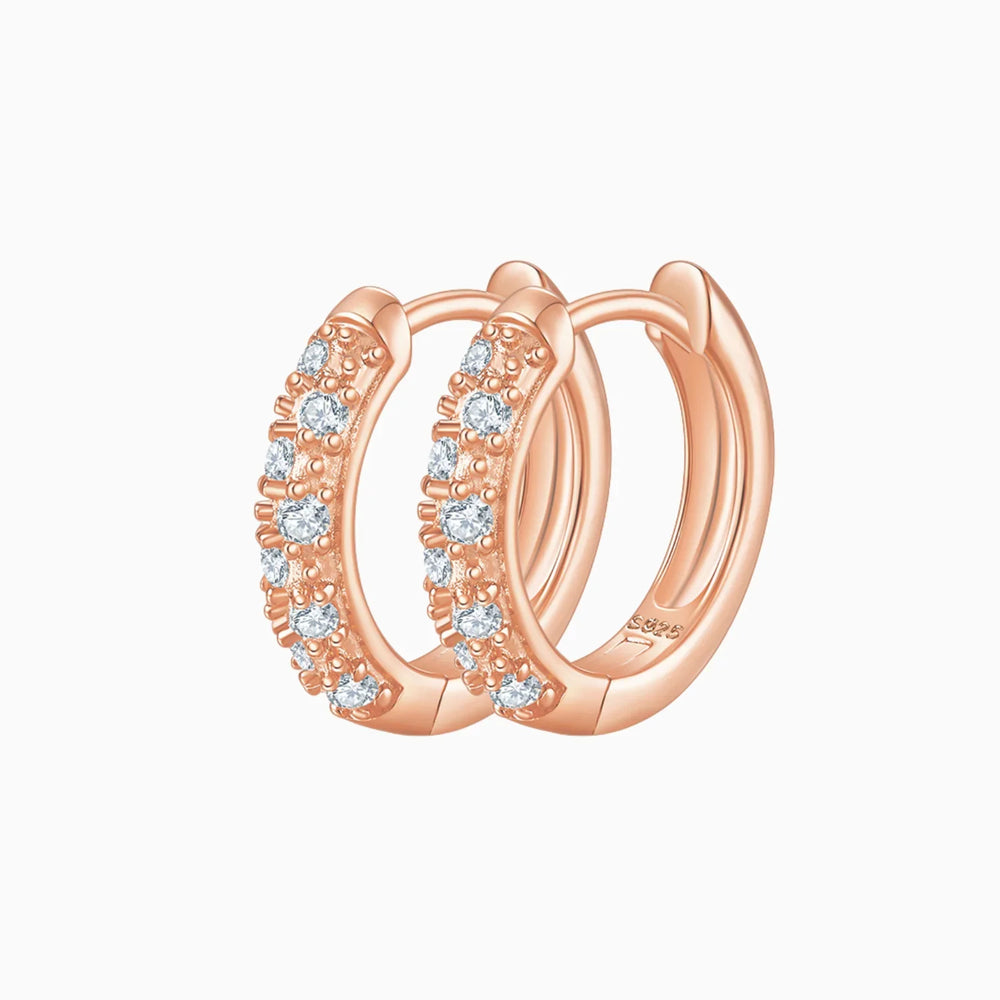 Half pavé moissanite huggie hoops in rose gold vermeil, curved hoop with half-row stones