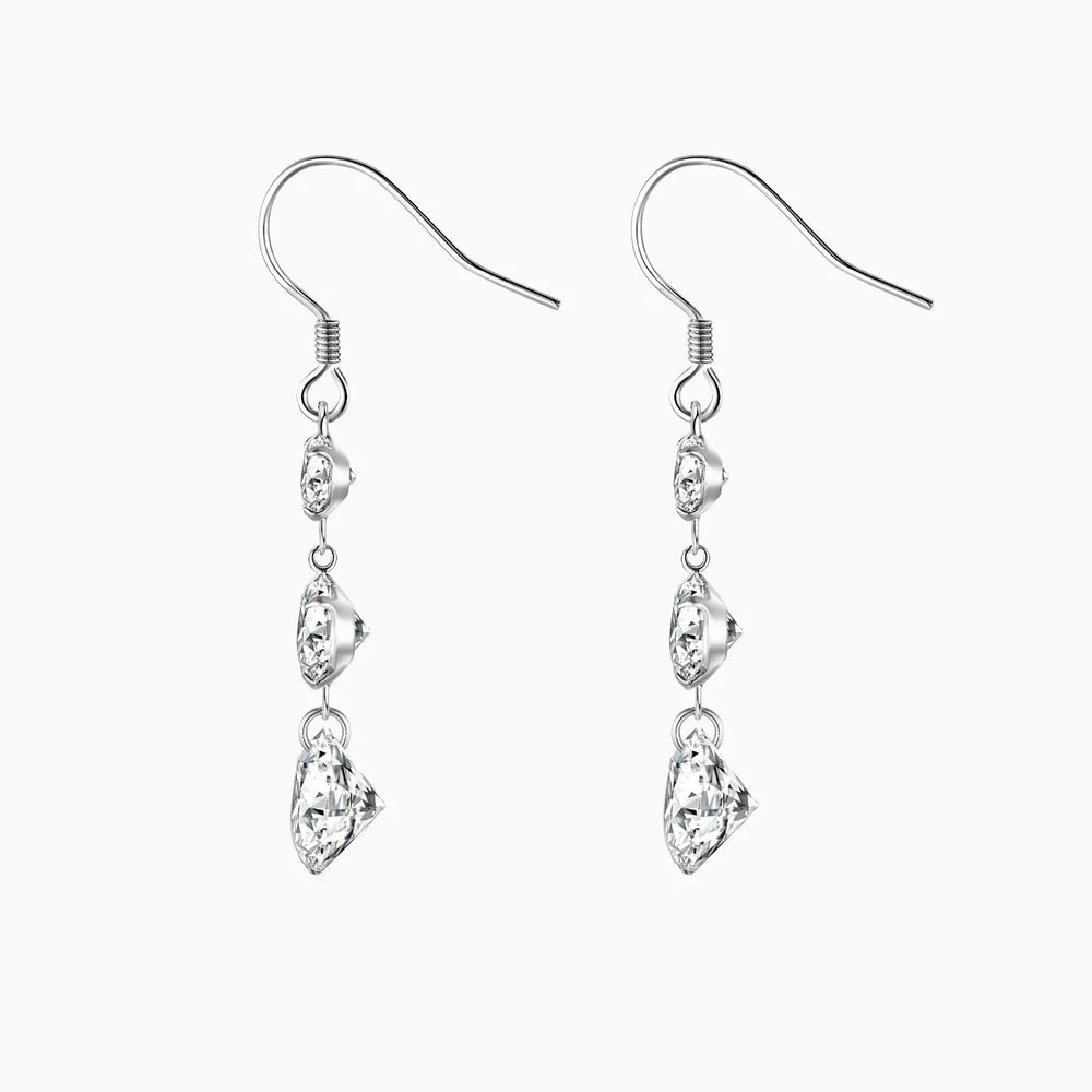 Three-stone drop earrings with top round and two elongated moissanite stones, white gold vermeil