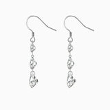 Three-stone drop earrings with top round and two elongated moissanite stones, white gold vermeil