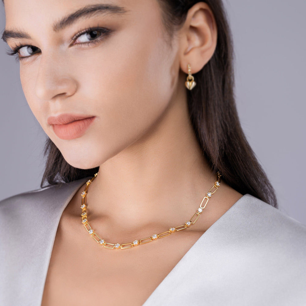 Yellow gold vermeil moissanite station chain necklace on model, close-up at neckline