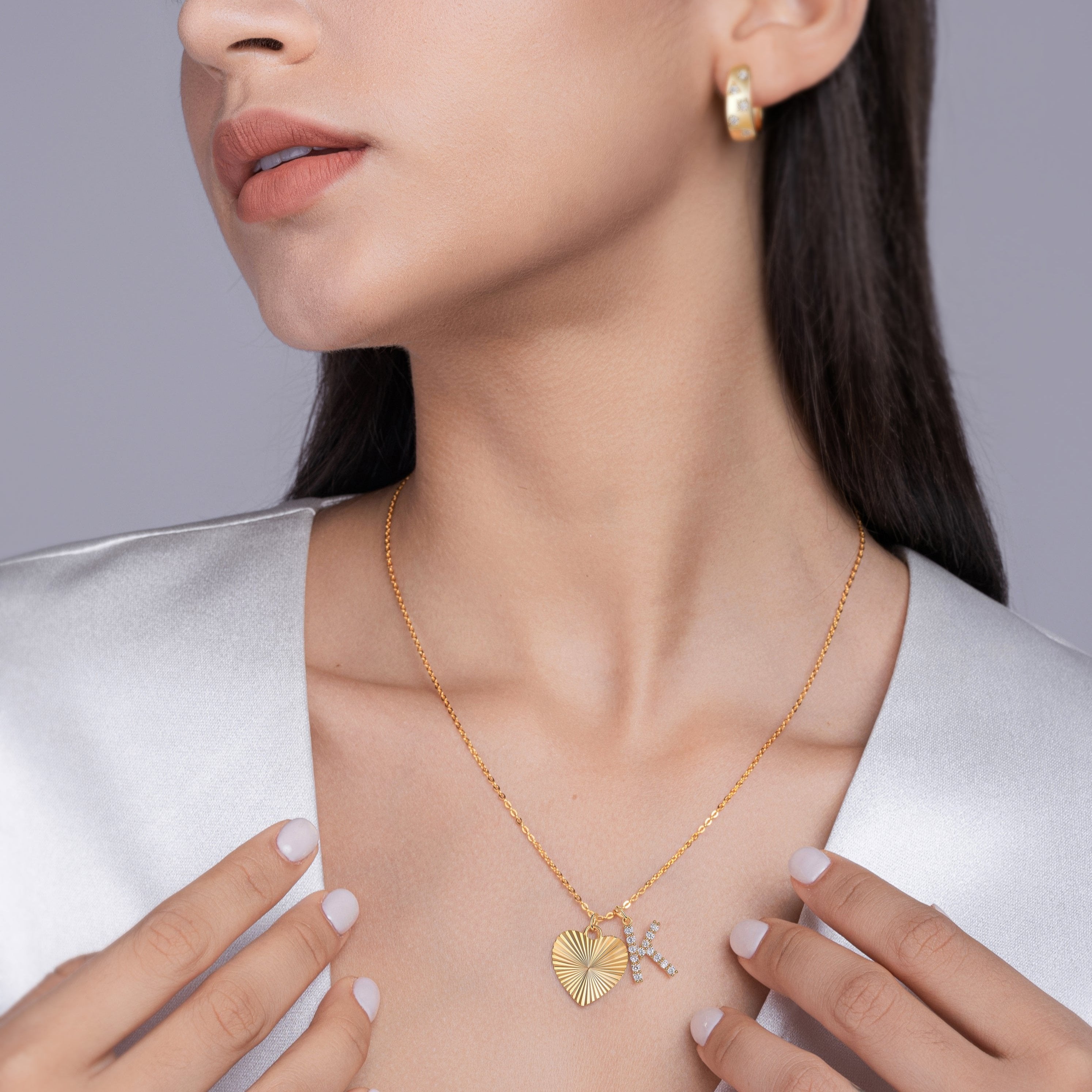 Heart-and-K moissanite initial necklace in yellow-gold vermeil on model