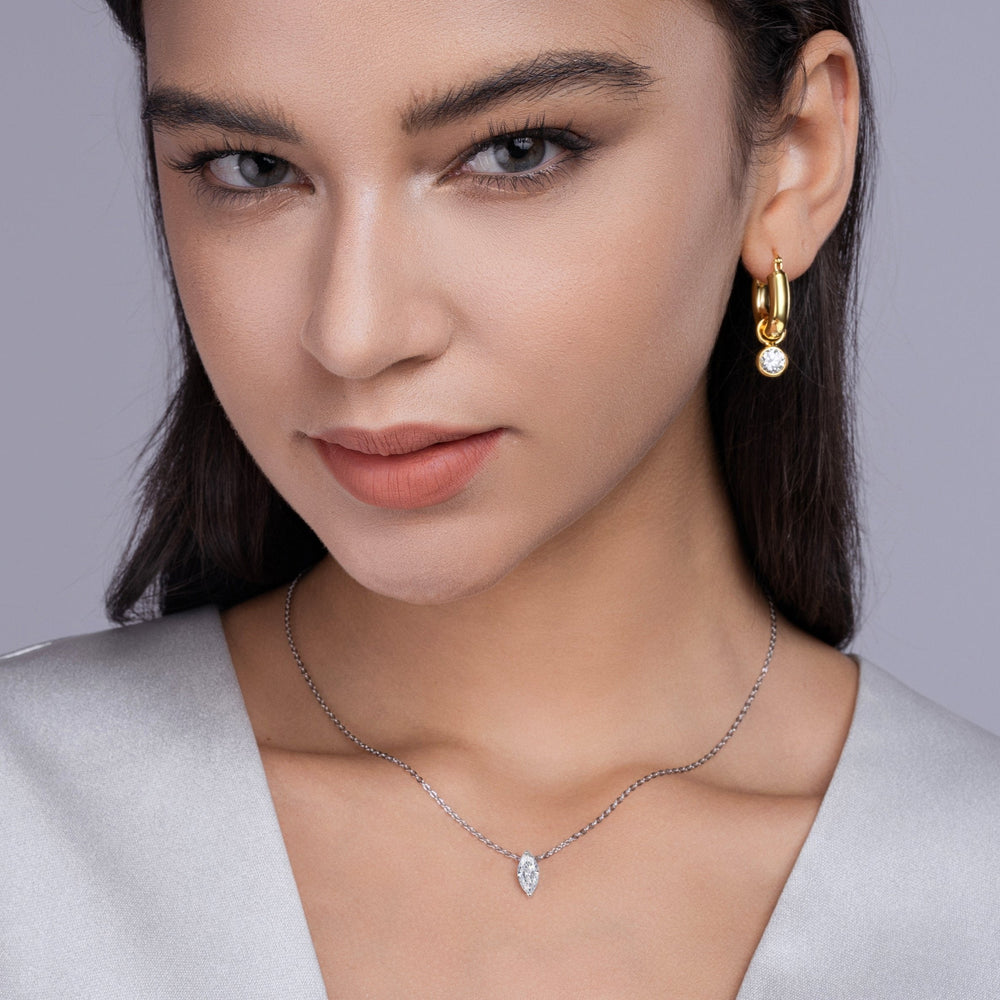 Marquise solitaire moissanite pendant necklace on model, white gold vermeil