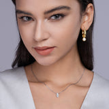 Marquise solitaire moissanite pendant necklace on model, white gold vermeil