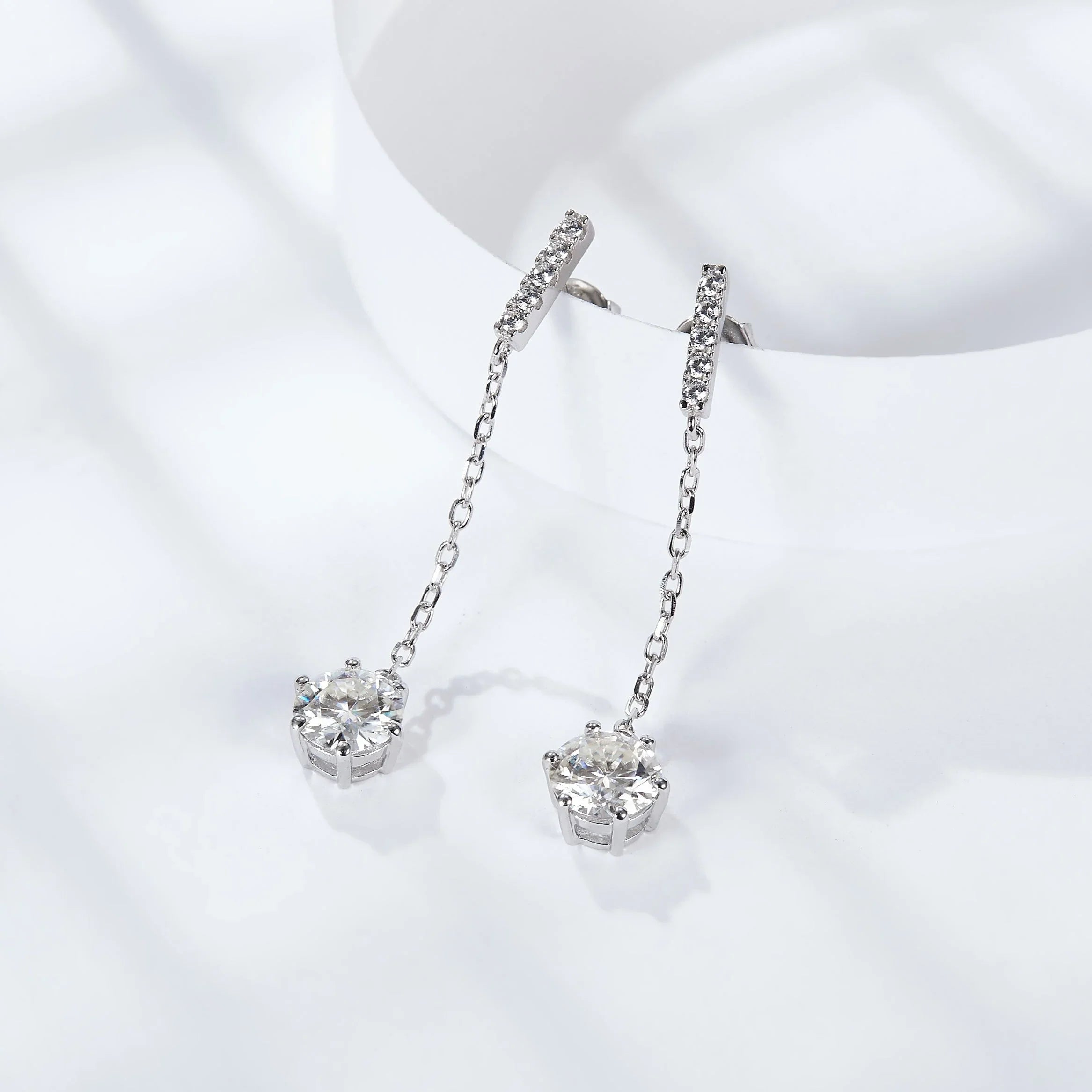 Chain-drop moissanite earrings with pavé bar posts and round stones in prong settings