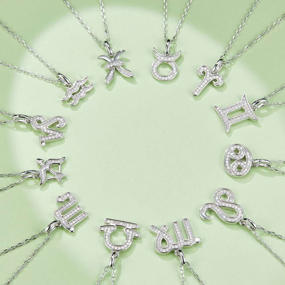 Zodiac moissanite pendants on silver-tone chains, assorted symbols with pave detailing