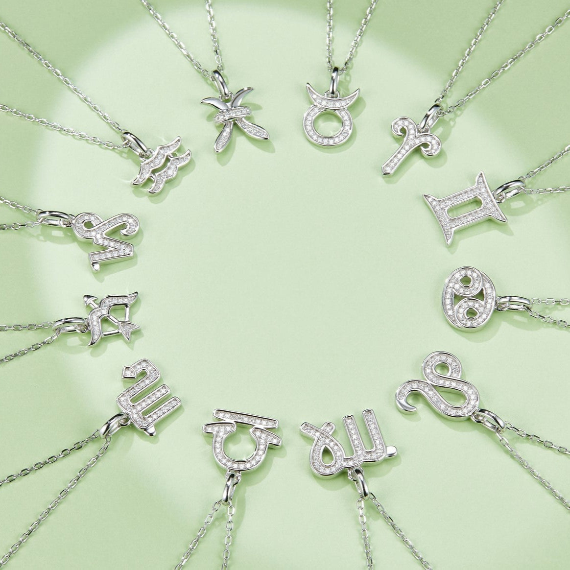 Zodiac moissanite pendant necklaces on chains, including a Sagittarius charm