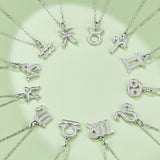 Silver-tone zodiac charm necklaces with multiple letter and star pendants on chains