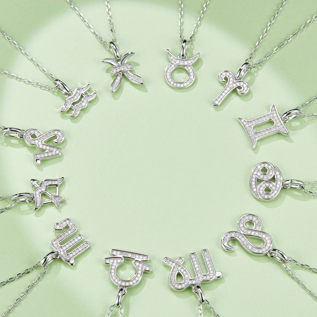 Zodiac pendant necklace assortment; one Libra charm with stone-studded design