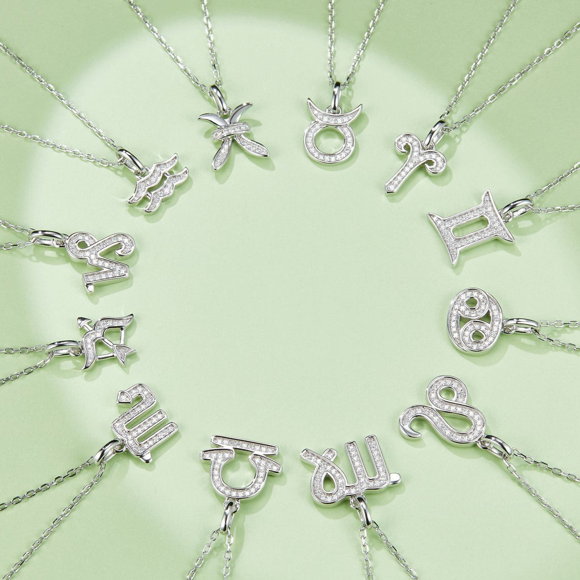 Assorted zodiac pendant necklaces featuring silver-tone gemstone charms