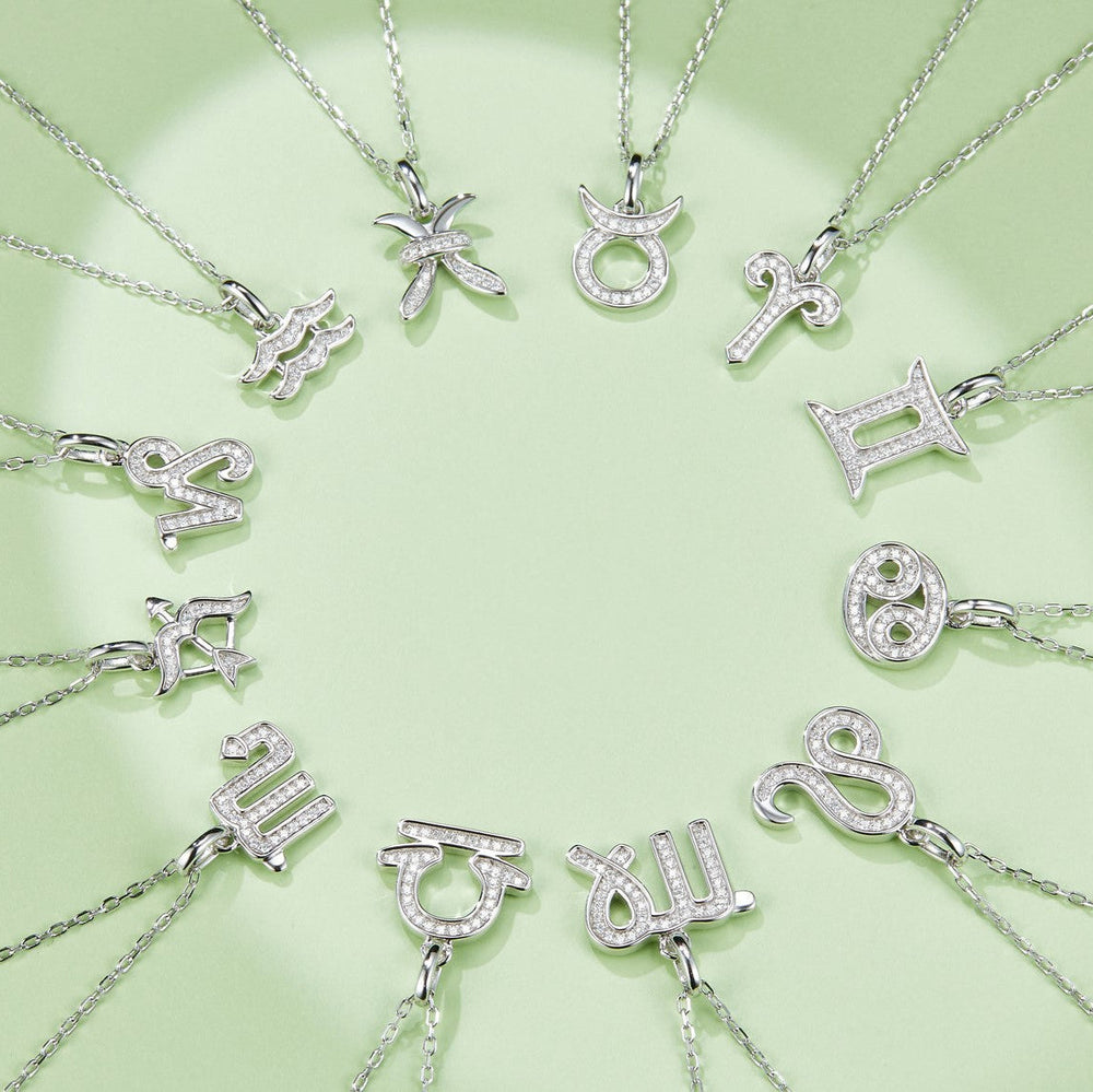 Assorted zodiac pendant necklaces featuring silver-tone gemstone charms