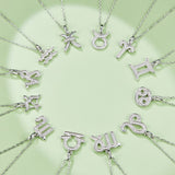 Assorted zodiac pendant necklaces featuring silver-tone gemstone charms